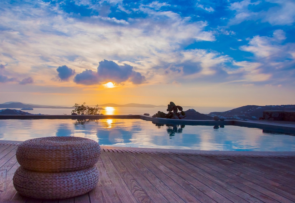 'The reflection of the beautiful clouds in the pool at sunset and the island ... Greece.' - Santorini